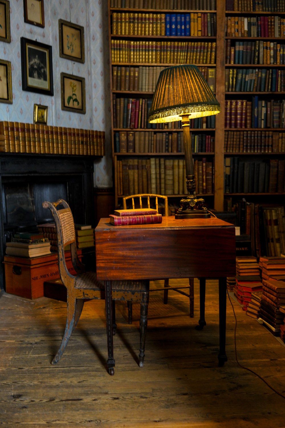 Study Room Study room with desk and lamp. Books in the background.